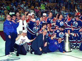 May 24, 1990. Edmonton Oilers pose for that famous team picture on the ice after the Oilers won their fifth Stanley Cup championship on May 24, 1990 after beating the Boston Bruins in five games. The team consisted of, Centres, #7 Mark Lamb,  #8 Joe Murphy, #11 Captain, Mark Messier and #14 Craig MacTavish. Wingers, 9 Glenn Anderson 10 Esa Tikkanen12 Adam Graves, #16 Kelly Buchberger, #17 Jari Kurri (A), #18 Craig Simpson,  #20 Martin Gelinas, #32 Dave Brown and #85 Petr Klima. Defencemen, #4 Kevin Lowe (A), #5 Steve Smith, #6 Jeff Beukeboom, #21 Randy Gregg, #22 Charlie Huddy, #25 Geoff Smith, #26 Reijo Ruotsalainen and #28 Craig Muni. Goaltenders, #30 Bill Ranford, #33 Eldon "Pokey" Reddick and #31 Grant Fuhr (injured). Coaching and administrative staff, Owner Peter Pocklington, President/General Manager
Glen Sather, Head Coach John Muckler, Co-Coach Ted Green, Asst. Coach Ron Low, Asst. General Manager Bruce MacGregor, Barry Fraser (Director of Player Personnel/Chief Scout), Bill Tuele (Director of Public Relations), Dr. Gordon Cameron (Chief of Medical Staff), Dr. David Reid (Team Physician) Ken Lowe (Athletic Tainer-Therapist), Barrie Stafford (Trainer), Stuart Poirier (Massage Therapist), Lyle Kulchisky (Asst. Trainer), Joey Moss (Locker-room Attendant) John Blackwell (Director of Hockey Operations, AHL), Garnet Bailey (Scout), Ed Chadwick (Scout), Lorne Davis (Scout), Harry Howell (Scout), Albert Reeves (Scout), Matti Vaisanen (Scout). Tom Braid/Edmonton Sun/QMI Agency