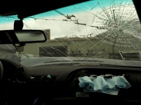 A deployed passenger side air bag is seen in a 2002 BMW at an auto dismantling facility in San Francisco on May 20, 2015. Japanese air bag manufacturer Takata Corp is doubling a recall of potentially deadly air bags to nearly 34 million vehicles, making it the largest automotive recall in American history. (REUTERS/Robert Galbraith)