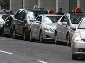 Taxi stand along Metcalfe Street in downtown Ottawa on Thursday May 21, 2015. Errol McGihon/Ottawa Sun/Postmedia Network