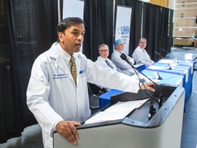 Dr. Atul Humar, Program Medical Director, Multi-Organ Transplant (MOT) Team, along with other members of the University Heath Network's MOT updates the media on Ottawa Senators owner Eugene Melnyk's recent liver transplant at Toronto General Hospital in Toronto, Ont. on Thursday May 21, 2015. Ernest Doroszuk/Toronto Sun/Postmedia Network