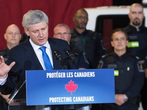 Prime Minister Stephen Harper speaking at Pierre-Elliott Trudeau International Airport on May 21, 2015. (Postmedia Network file photo)