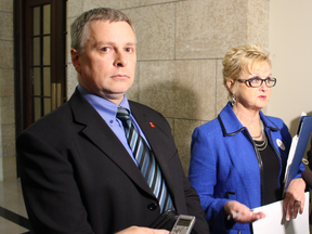 Donald Lepp (left) and Progressive Conservative health critic Myrna Driedger discuss why they believe scheduled appointments at emergency rooms must stop. Lepp recently waited five hours with his six-year-old son Russell in an ER for an injection after a heart transplant left his son's immune system vulnerable.