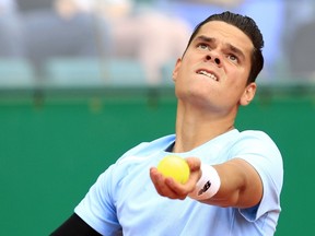 Canada's Milos Raonic serves to Czech Republic's Tomas Berdych during their tennis match at the Monte-Carlo ATP Masters Series Tournament, on April 17, 2015 in Monaco. (AFP PHOTO/JEAN CHRISTOPHE MAGNENET)