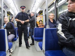 EPS Staff Sergeant Graham Blackburn patrols a downtown LRT train in support of Crime Prevention Week, in Edmonton, Alta. on Thursday May 14, 2015. David Bloom/Edmonton Sun