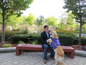 Lawyer J. Andrew Sprague and his service dog Flicka. (Supplied photo)
