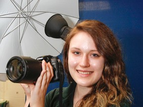 Claudia Pawlak, a Grade 12 student at Holy Cross Catholic Secondary School, poses for a photo in the schools Communications Technology lab, in Kingston, Ont. on Tuesday May 19, 2015. Pawlak is heading to the national skills competition in Saskatoon, May 27 to 30, after winning a gold medal at the provincial level in photography. (Julia McKay/The Whig-Standard)