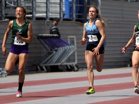 Glendale High School runner Haleigh Cole, right, takes part in the finals of the midget girls' 100m dash in London, Ont. on Thursday May 21, 2015 at TD Waterhouse Stadium at Western University for WOSSAA track and field finals. Cole won with a time of 12.72 seconds, which was 0.08 seconds off the WOSSAA record. (Greg Colgan/Woodstock Sentinel-Review/Postmedia Network)