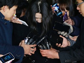 Cho Hyun-ah (C), also known as Heather Cho, daughter of chairman of Korean Air Lines Cho Yang-ho, is surrounded by the media as she leaves for a detention facility after a court ordered her to be detained, at the Seoul Western District Prosecutor's office in this December 30, 2014 file photo.
REUTERS/Kim Hong-Ji/Files
