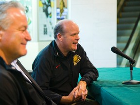 Mark Hunter (right) joined the Leafs' front office last October without any fanfare, just a press release. (MIKE HENSON, Postmedia Network)