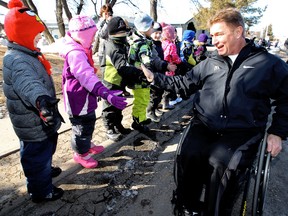 Rick Hansen Ecole is greeted by students from Ecole Bellevue School as he makes his way through Beaumont, AB., Monday March 12, 2012. The stop was part of Hansen's 25th Anniversary Relay.  DAVID BLOOM EDMONTON SUN
