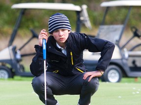 Sam Hebert lines up his shot on the green during OFSAA golf action. Hebert was a student at Parkside Collegiate Institute in this 2012 photo.