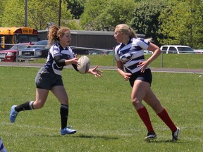 Monique Sluys, right, passes the ball to teammate, Sarah Houston. (Laura Broadley Clinton News Record)