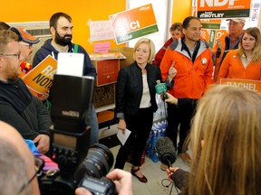 Alberta NDP leader Rachel Notley speaks with media at the headquarters of candidate Joe Ceci, to her right, on Saturday April 25, 2015. Ceci is now the NDP MLA for Calgary-Fort. Mike Drew/Calgary Sun/Postmedia Network