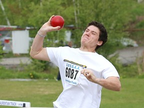 Eric Paquette, of College Notre-Dame, competes in the senior boys shot put event at the local high school track and field championships at the track at Laurentian University on Thursday. John Lappa/Sudbury Star
