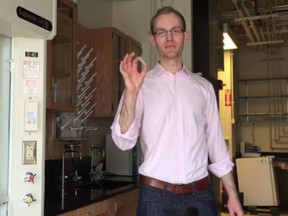 Chemical engineering graduate from MIT Carl Schoellhammer holds his invention, a stainless steel pill covered in needles, that could eliminate the need for traditiona, painfull syringes. (Postmedia Network/YouTube)