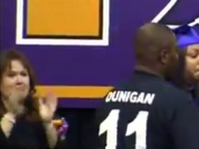 Katherine Jackson, whose 18-year-old son was killed in an alleged drunk-driving crash after his high-school prom last weekend, is embraced as she arrives on stage to accept her son's diploma at his graduation. YouTube/Screengrab