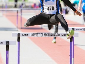 Cody Pauli of Mitchell DHS leads the 400m senior boys' hurdles at the start of the second day of the WOSSAA track and field meet in London on Friday, May 22. MIKE HENSON/POSTMEDIA NETWORK