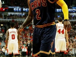 Kyrie Irving of the Cleveland Cavaliers reacts after being injured in the second quarter against the Chicago Bulls during Game Six of the Eastern Conference Semifinals of the 2015 NBA Playoffs on May 14, 2015. (Jonathan Daniel/AFP)