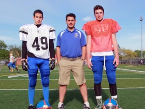 From left, Sarnia Sturgeons junior varsity middle linebacker Bennett Vani, head coach Vince Flamia and quarterback Nick Iacobelli stop for a photo during practice at Norm Perry Park on Wednesday May 20, 2015 in Sarnia, Ont. (Terry Bridge/Sarnia Observer/Postmedia Network)