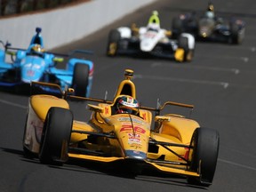 Ryan Hunter-Reay driver of the #28 DHL Andretti Autosport Honda Dallara leads a pack of cars during final practice on Carb Day for the the 99th running of the Indianapolis 500 Mile Race at Indianapolis Motorspeedway on May 22, 2015 in Indianapolis, Indiana.  Chris Graythen/Getty Images/AFP
