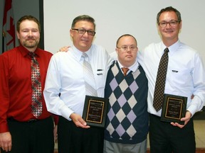 Local business owners Richard Ponic and Gregory Boyle were handed the Community Living Sarnia-Lambton hero award for their efforts in hiring employees with identifiable disabilities and for increasing accessibility at their stores. From left are manager of community employment for Community Living Sarnia-Lambton Bob Vansickle, Ponic, Community Living board member Kevin Schenk, and Boyle. (Terry Bridge/Sarnia Observer/Postmedia Network)