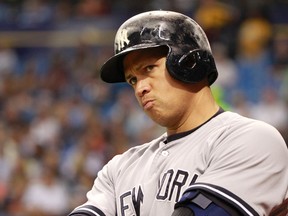 New York Yankees designated hitter Alex Rodriguez (13) looks on during the fifth inning against the Tampa Bay Rays at Tropicana Field. (Kim Klement-USA TODAY Sports)