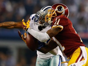 Orlando Scandrick #32 of the Dallas Cowboys breaks up the pass intended for DeSean Jackson #11 of the Washington Redskins during the first half at AT&T Stadium on October 27, 2014 in Arlington, Texas. (Tom Pennington/Getty Images/AFP)
