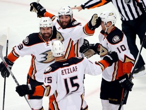 Anaheim Ducks left wing Patrick Maroon celebrates with teammates Francois Beauchemin, Ryan Getzlaf and Corey Perry after scoring a goal against the Chicago Blackhawks. (Jerry Lai/USA TODAY Sports)