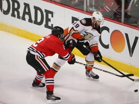 Anaheim Ducks left wing Patrick Maroon (19) controls the puck against Chicago Blackhawks defenseman Duncan Keith (2) during the third period in game three of the Western Conference Final of the 2015 Stanley Cup Playoffs at United Center on May 21, 2015. Jerry Lai-USA TODAY Sports