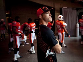 Injured B.C Lions QB Travis Lulay watches player introductions before the start of his teams game. (REUTERS/Ben Nelms)
