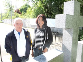 Legion branch president Allan Jones, left, and artist Michelle Parboosingh, stand in the branch parking lot in Kingston, Ont. on Fri., May 22, 2015 in front of a concrete wall that will be used for a mural honouring Canada's veterans. Michael Lea/The Whig-Standard/PostMedia