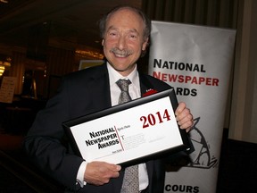 Toronto Sun Photographer Stan Behal shows off his National Newspaper Award for sports photography at the Sheraton Hotel in Toronto on May 22, 2015. (Jenny Yuen/Toronto Sun)