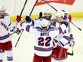 New York Rangers right wing Martin St. Louis (26) celebrates with teammates after scoring a goal against the Tampa Bay Lightning in the third period in game four of the Eastern Conference Final of the 2015 Stanley Cup Playoffs at Amalie Arena on May 22.  Kim Klement-USA TODAY Sports