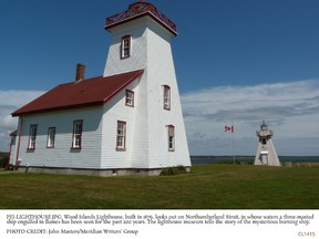 P.E.I.'s  Wood Islands Lighthouse looks over the Northumberland Strait, where a burning three-masted ship has been seen off and on for 200 years. JOHN MASTERS/MERIDIAN WRITERS’ GROUP
