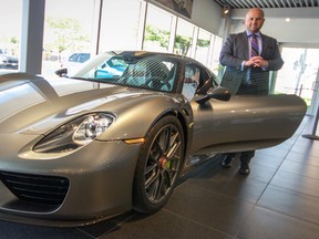 Tim Bamford, sales specialist at Porsche of London, shows off the $1.4 million Porsche 918 Spyder.  Bamford, a St. Thomas native, spent over a year brokering the deal on the custom car which was manufactured by hand in Germany and purchased by an unnamed client in the region.