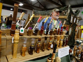 Wayne Howard of Quinte West shows off his homemade duck calls during the Sportsman's Gathering in Tweed,. 
Emily Mountney-Lessard/Belleville Intelligencer/Postmedia Network