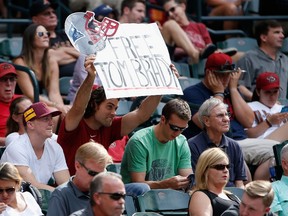 A fan hold ups a Patriots "Free Tom Brady" sign during a game between the Diamondbacks and Nationals in Phoenix on May 13, 2015. (Christian Petersen/Getty Images/AFP)