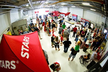 Members of the public visit the Shock Trauma Air Rescue Society (STARS) hanger in Winnipeg, Man., on Sat., May 23, 2015. The open house took place in conjuction of 30th anniversary celebrations across Western Canada. (Brook Jones/Postmedia Network)
