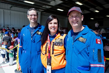 STARS flight nurse Sarah Painter (middle) hangs out with pilots Andrew Davidson (l) and Paul Adams (r) during an open house at the Winnipeg base on the afternoon of Sat., May 23, 2015. (Brook Jones/Postmedia Network)