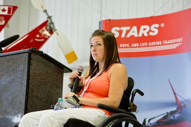 Maranda Lanouette, who is now a STARS Very Important Patient (VIP), speaks about her experience with a STARS air ambulance after she was injured in an ATV accident. Lanouette was a guest speaker at an open house held at the STARS base in Winnipeg, Man., on Sat., May 23, 2015. (Brook Jones/Postmedia Network)