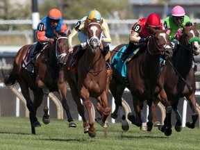 Jockey Gary Boulanger guides Sky Treasure to victory in the $200,000 Nassau Stakes at Woodbine Racetrack on Saturday. (Michael Burns/photo)