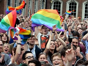 Supporters react outside Dublin Castle following the announcement of the result of the same-sex marriage referendum in Dublin on May 23, 2015. Ireland on Saturday became the first country in the world to approve gay marriage by popular vote as crowds cheered in Dublin in a spectacular setback for the once all-powerful Catholic Church.
AFP PHOTO/PAUL FAITH