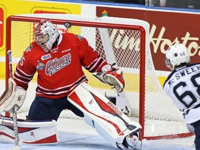 Oshawa Generals' goaltender Ken Appleby (35) makes a save against Rimouski Oceanic's Guillaume McSween (68) during the second period of their Memorial Cup hockey game in Quebec City, May 23, 2015  REUTERS/Christinne Muschi