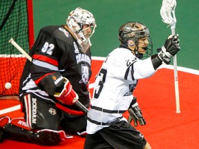 Jarrett Davis of the Edmonton Rush celebrates a goal on Calgary Roughnecks goalie Frankie Scigliano in Calgary, Alta., on Saturday, May 23, 2015. It was Game 2 of the NLL's West Division Final. Lyle Aspinall/Calgary Sun/Postmedia Network