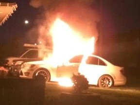 A car burns early Saturday in a driveway near 12 Ave. and 70 St. SW.