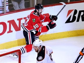 Antoine Vermette #80 of the Chicago Blackhawks celebrates after scoring the game winning goal in the second overtime period to defeat the Anaheim Ducks 5-4 in Game Four of the Western Conference Finals during the 2015 NHL Stanley Cup Playoffs at the United Center on May 23, 2015 in Chicago, Illinois.  Tasos Katopodis/Getty Images/AFP