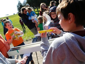 Kids prepare to race their homemade sailboats during the Pioneer Club's year-end celebration at West Riverside Park, Saturday. 
Emily Mountney-Lessard/Belleville Intelligencer/Postmedia Network