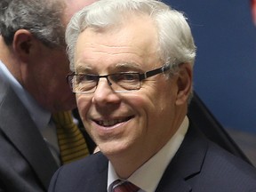 Manitoba Premier Greg Selinger smiles after listening to the delivery of the provincial budget in Winnipeg, Man. on April 30, 2015. (Brian Donogh/Winnipeg Sun)