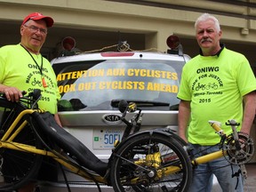 Richard Hudon, from Ottawa (left) and Peter Page, from Hamilton, are biking from Ottawa to Toronto for the Injured Workers Day rally on June 1 at Queen's Park. The pair's 600 km ride will stop in Cornwall, Brockville, Belleville, Kingston, Cobourg and Oshawa before arriving in Toronto.
(Keaton Robbins/Ottawa Sun)