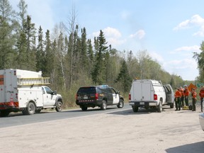 Emergency crews block Highway 637 into Shoal Lake Saturday, May 23, after a 350-hectare fire burned about eight kilometres north of Shoal Lake 39. (SAMANTHA SAMSON/Postmedia Network)